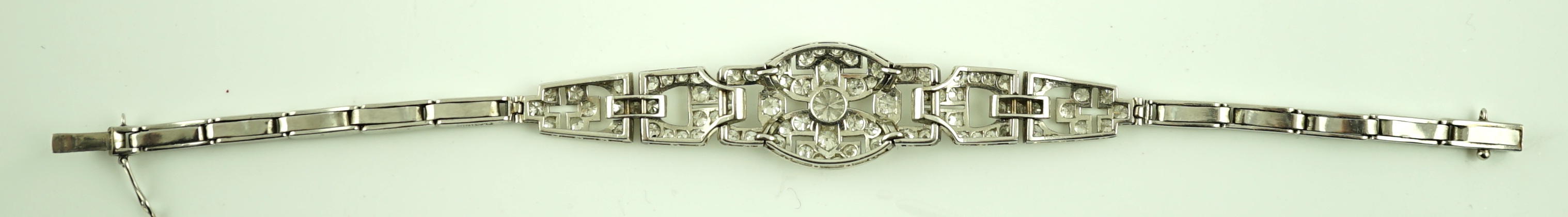 A 1950's platinum and diamond cluster set expanding link bracelet